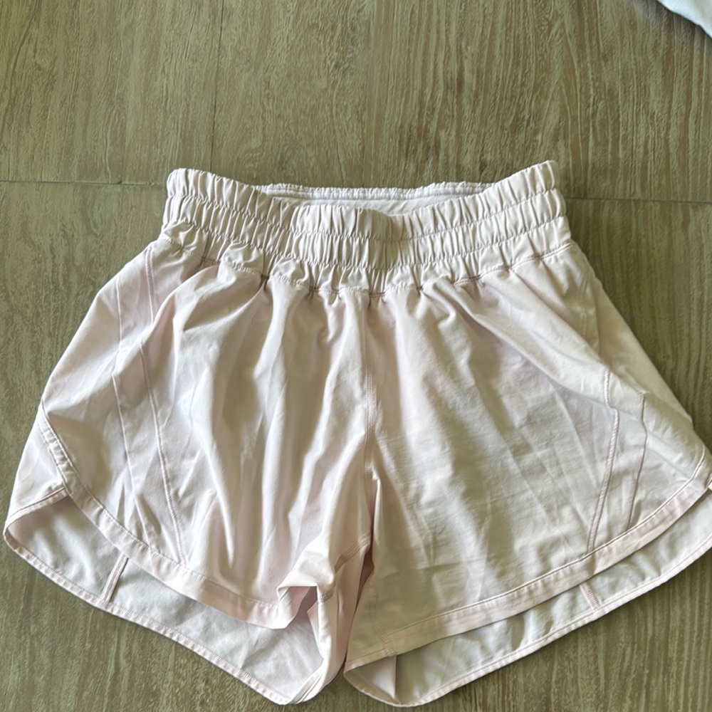 Lululemon Pink Athletic Shorts with Elastic Waistband and Curved Hem